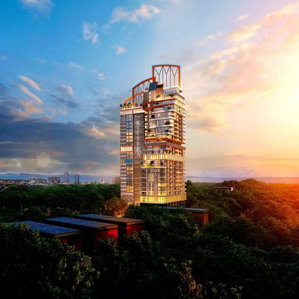 2a03e3cb-3a68-4c34-bd2b-177f5f8e5d79 Modern high-rise residential tower rising from a green forest at sunset