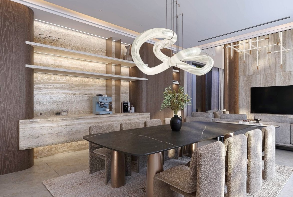 Modern showroom interior with a dark oval dining table, textured carpet, and wood-paneled walls under warm lighting with a sculptural white light fixture overhead.