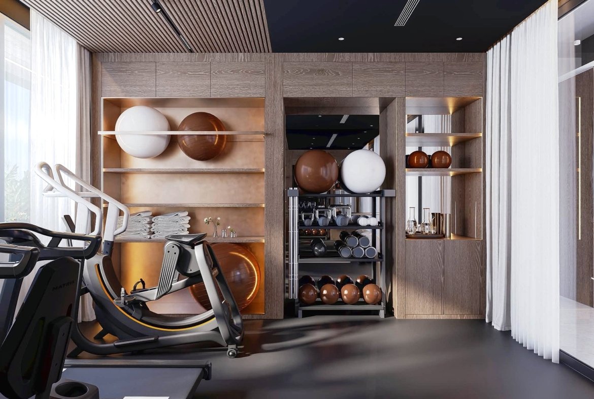 Modern gym interior with cardio treadmills in the foreground and wooden shelves holding orange and white exercise balls beneath a dark ceiling.