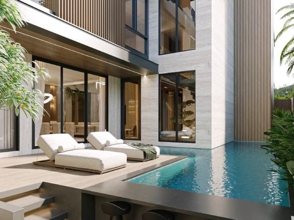 Modern house exterior with glass walls wood slats and a poolside deck with white lounge chairs by the water
