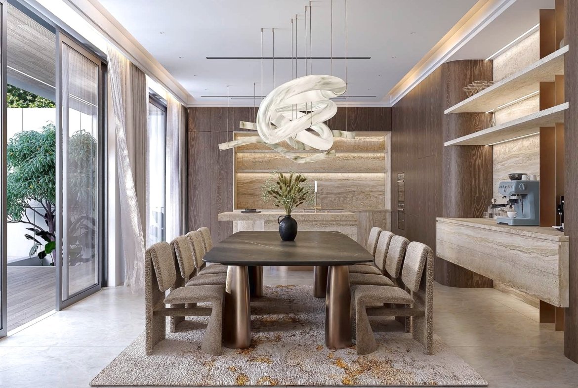 Contemporary dining room with a dark oval table, beige upholstered chairs, marble counters, and a sculptural white chandelier hanging overhead above a luxurious setting.