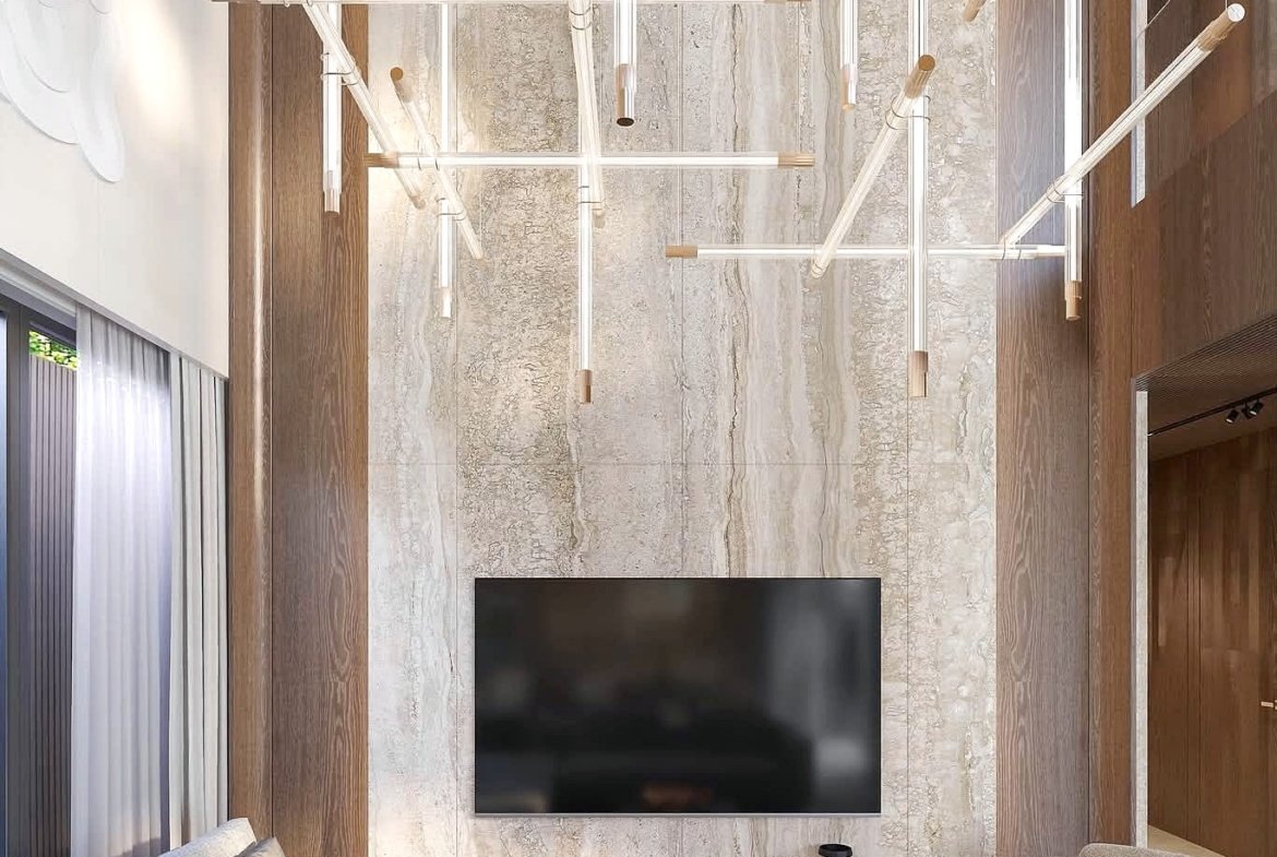 Modern living room with a marble feature wall, wall-mounted TV, and a dramatic multi-pendant chandelier overhead.