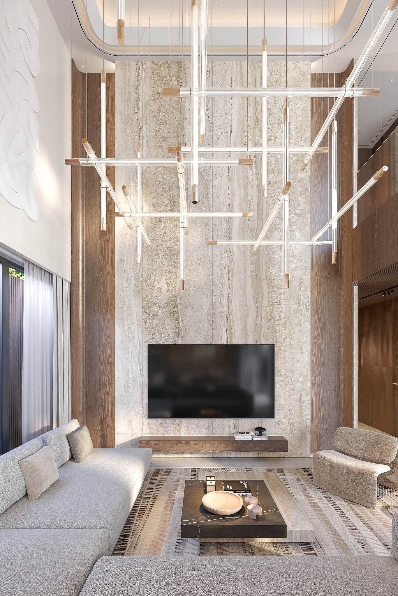 Astera_Villa_Pattaya_9 Modern living room with a marble feature wall, wall-mounted TV, and a dramatic multi-pendant chandelier overhead.