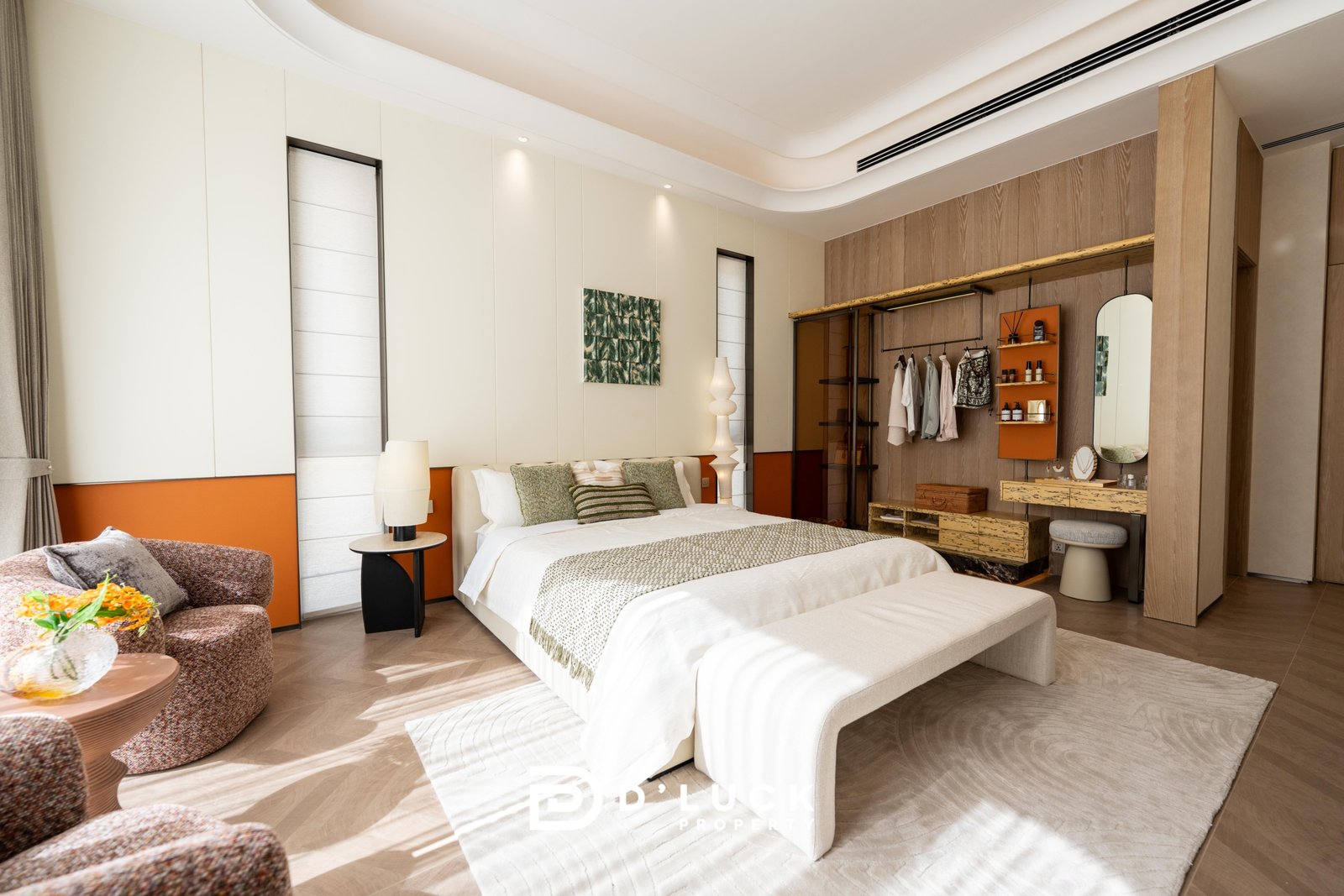 Big_V_Pattaya_Type_A_90 Hotel bedroom with two neatly made beds, warm neutral tones, and a sitting area with patterned chairs.