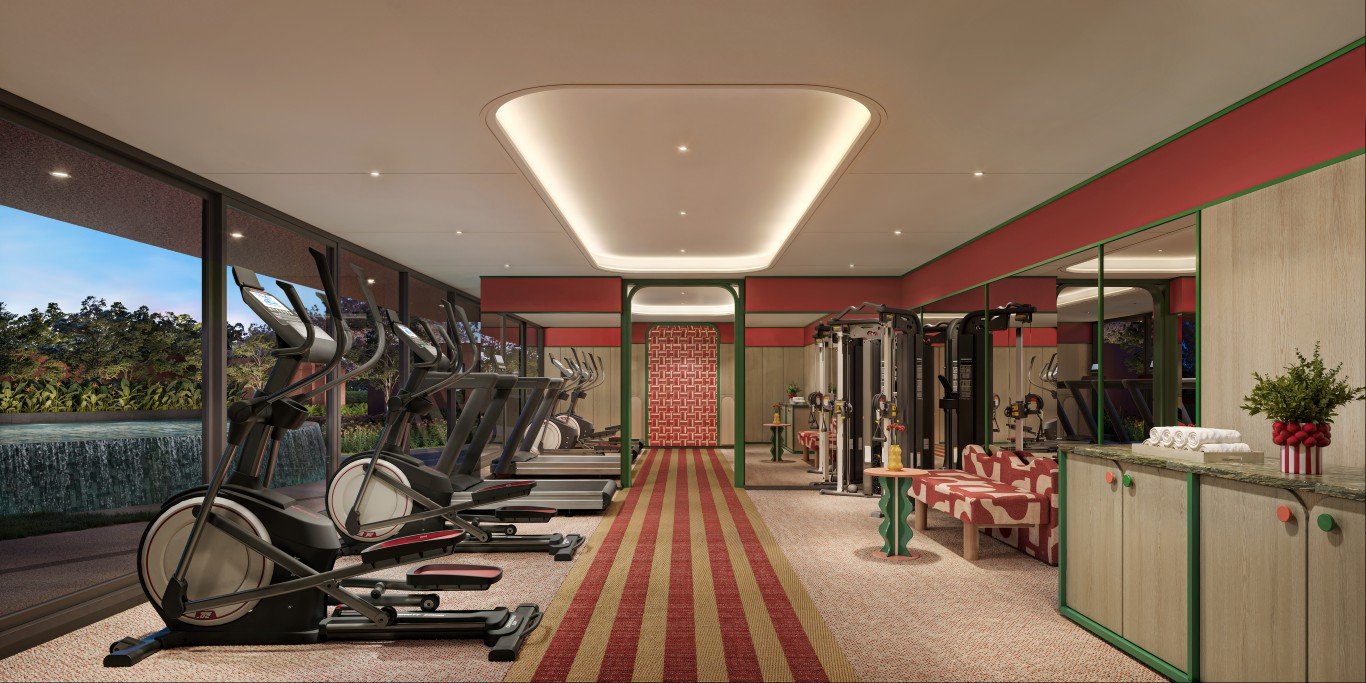 INT_FITNESS_FINAL Luxury hotel gym with treadmills along a glass wall overlooking a garden exterior.