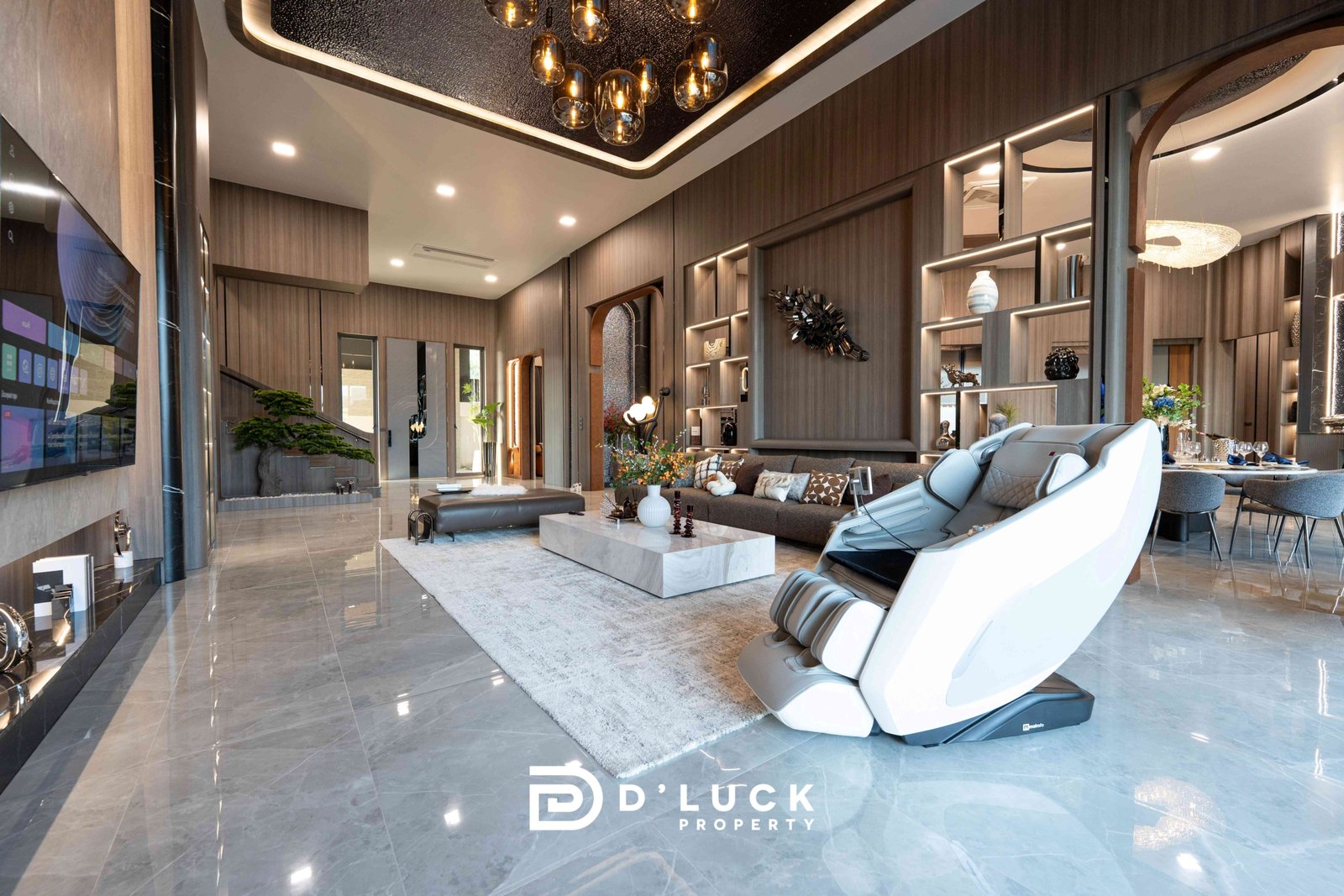 M-Mountian-M3 107 Luxurious open-plan living room with gray marble floors, dark wood walls, and a large white massage chair by a glass coffee table