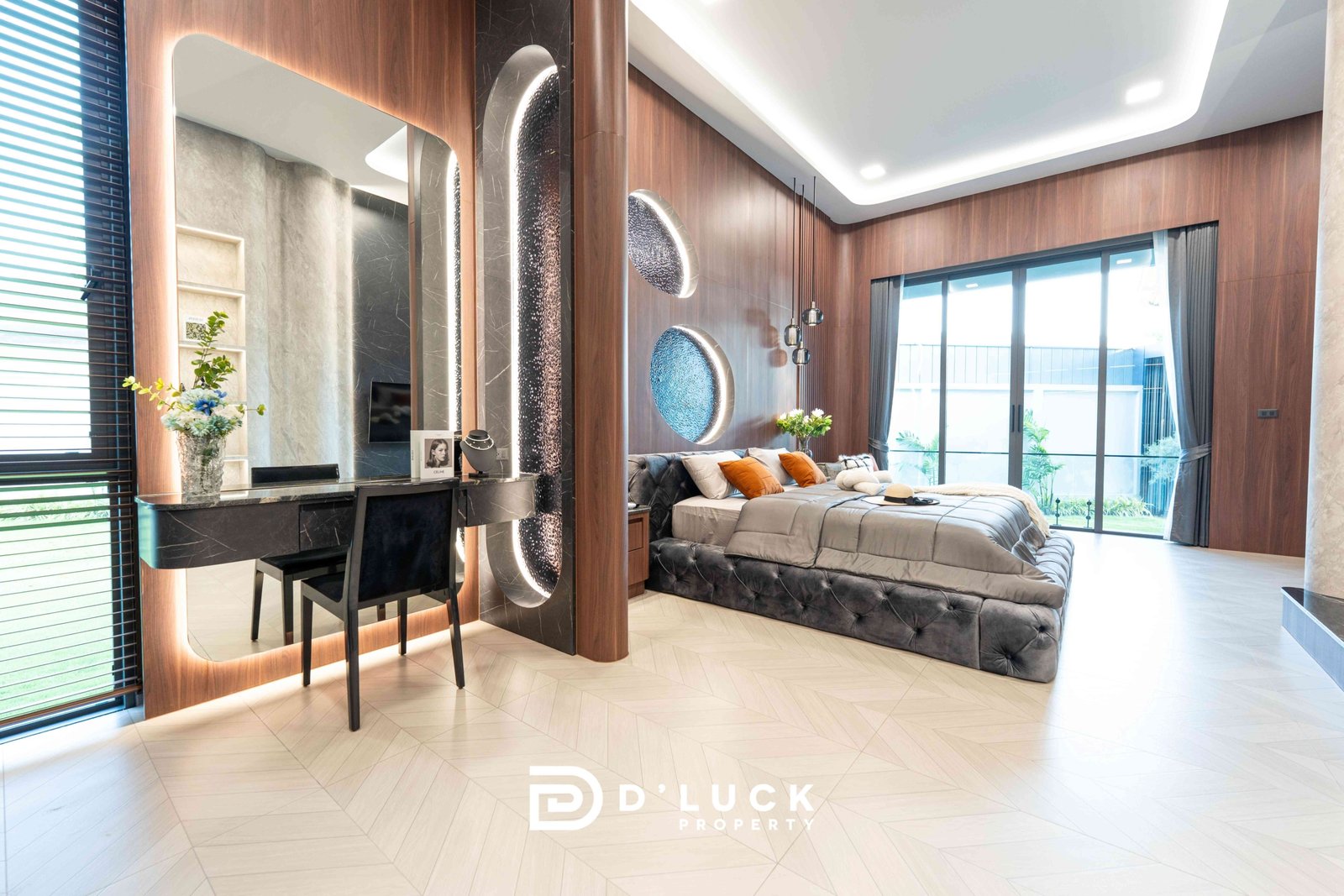 M-Mountian-M3 69 Luxurious modern bedroom with wood-paneled walls, a tufted gray bed and orange throw pillows, and large sliding balcony doors